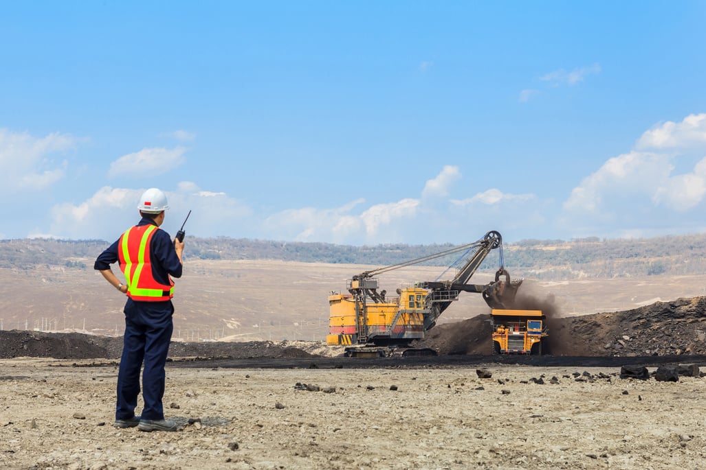 Mining Engineer Monitoring a Dump Truck 